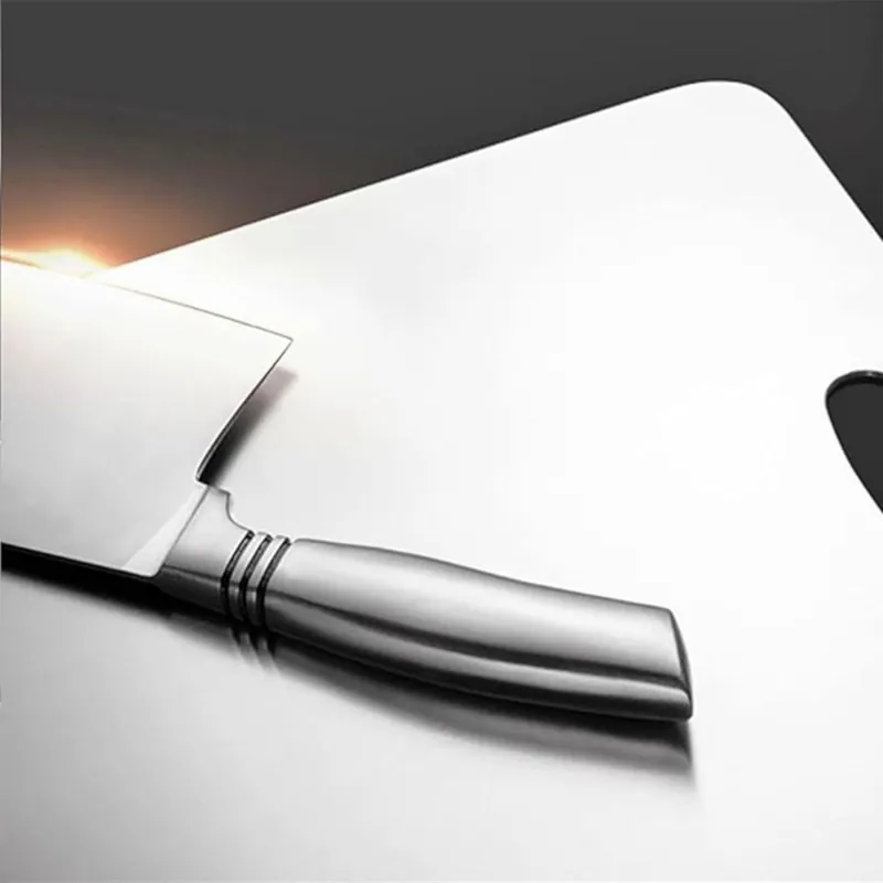 A knife resting on the brushed titanium surface
